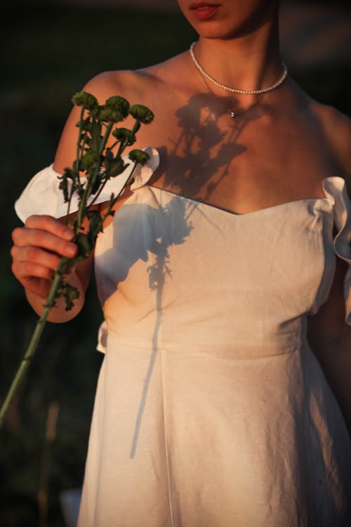A Person Holding Flowers