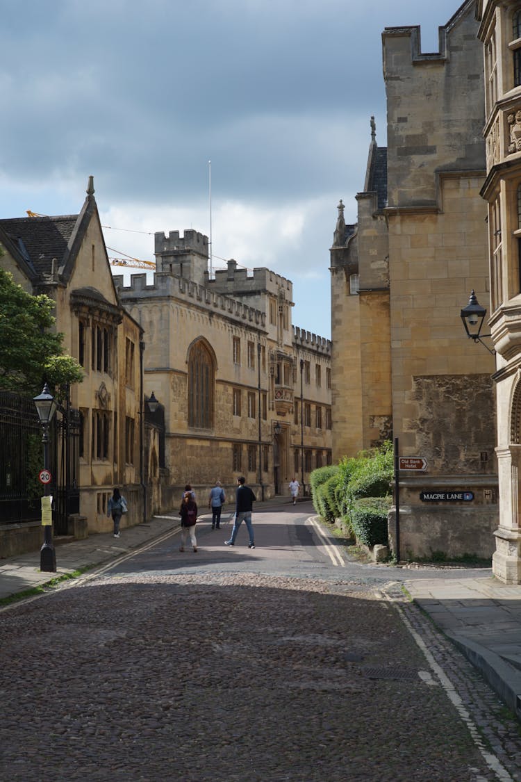 People Walking Near Corpus Christi College On Merton Street In Oxford, England