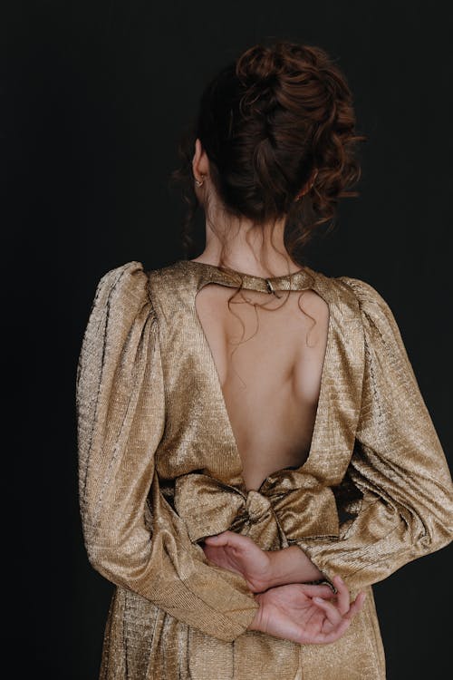 Back View of a Woman Wearing an Elegant Backless Dress · Free Stock Photo