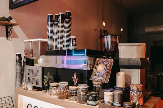 Aesthetic café setup featuring coffee machines, cups, and diverse jars for a relaxing vibe.