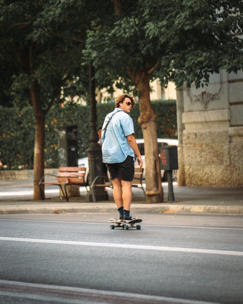 Man on Skateboard on Street