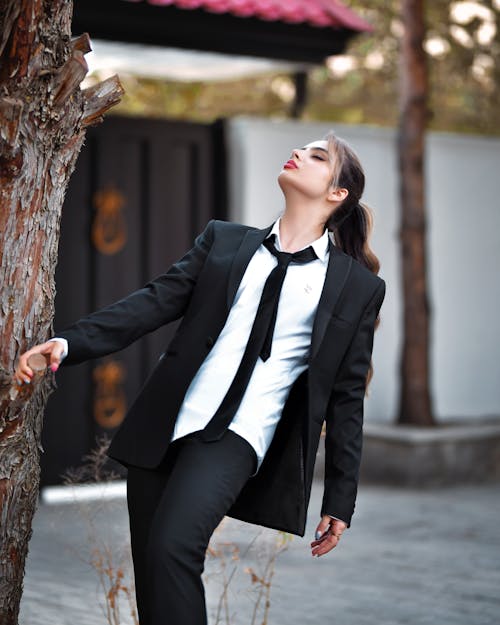 Portrait of a Female Model Wearing a Black Suit