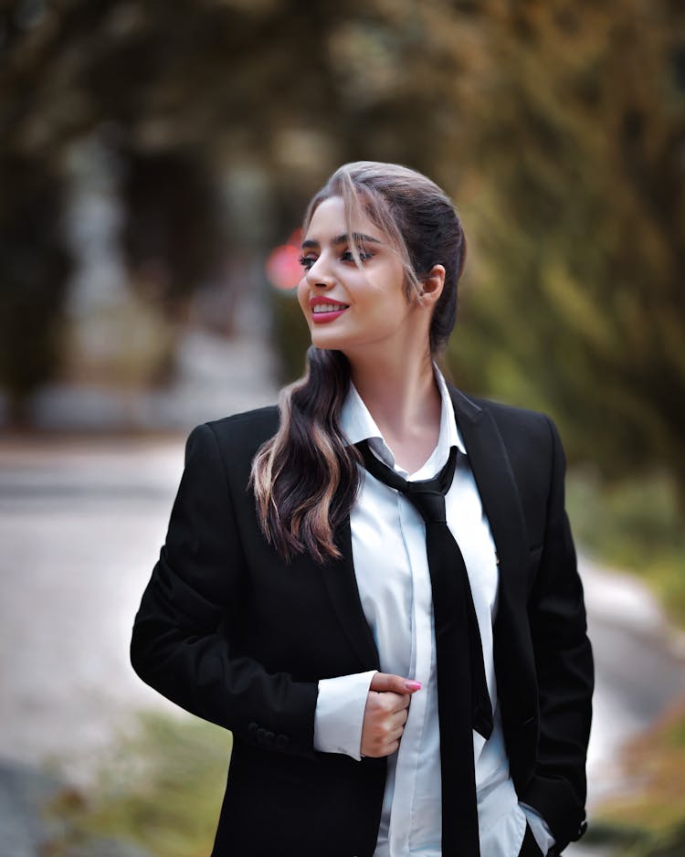 Smiling Woman Wearing Suit And Necktie