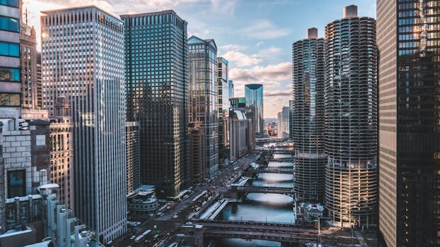 A breathtaking view of Chicago's iconic skyscrapers and waterway at day with a clear sky.