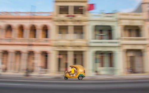 Man Driving a Taxi Auto Rickshaw