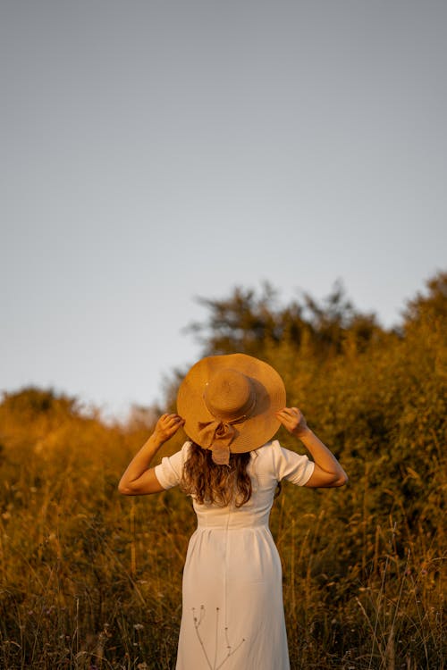 Woman Wearing Hat on a Field