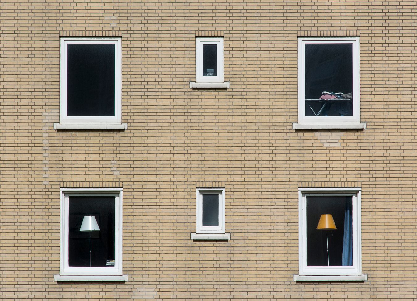 A side-by-side comparison of double-pane and triple-pane windows installed in a home