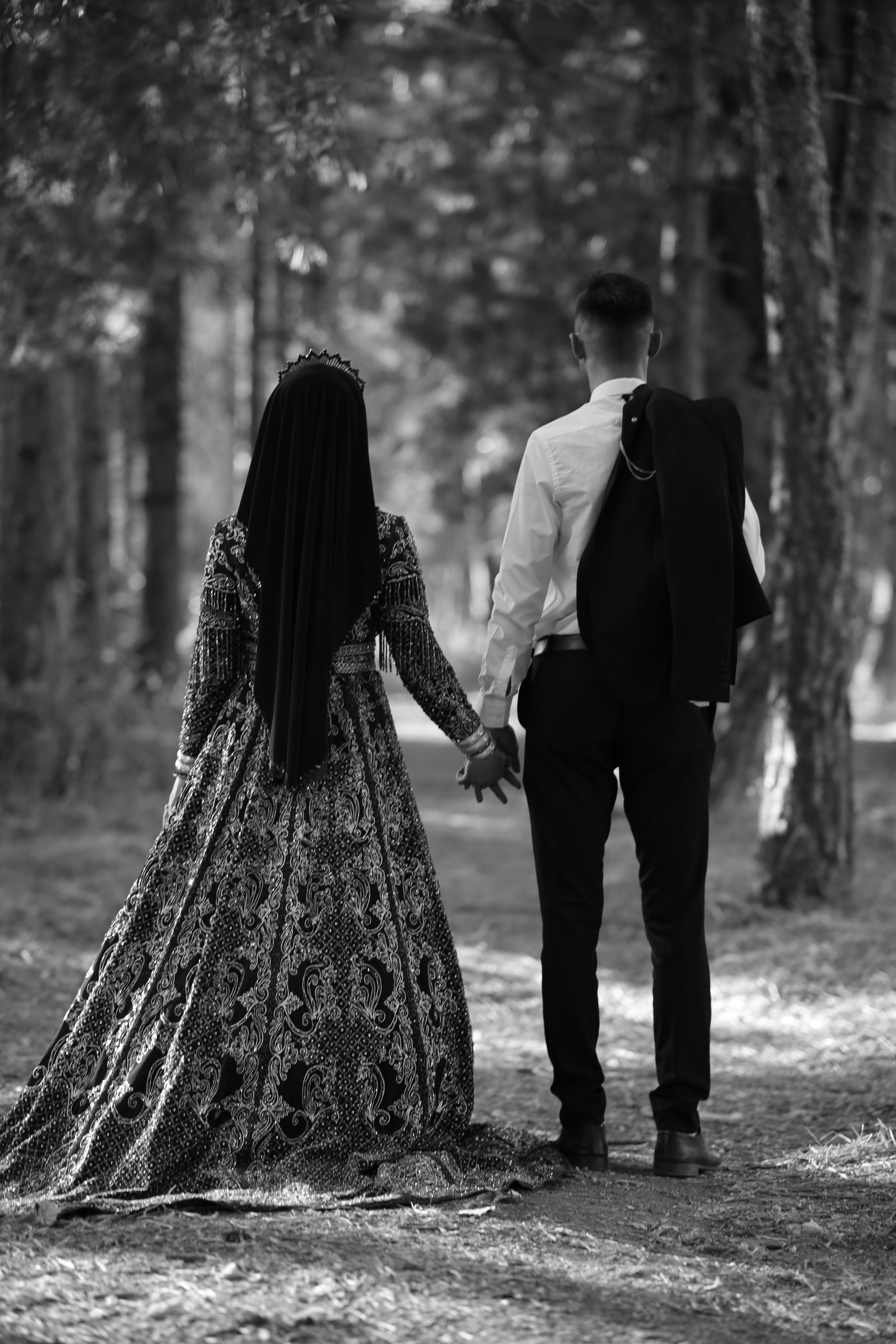 Back View of Couple in Dress and Shirt Holding Hands in Forest · Free ...