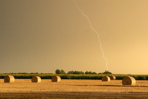 Lightning on Sky over Hay Bales