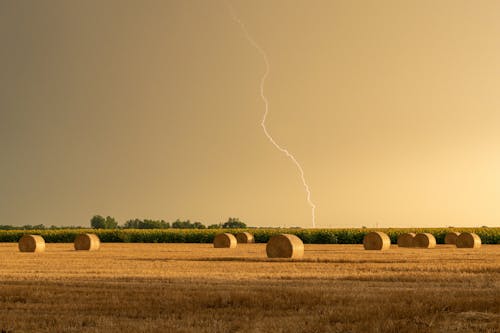 Bales of Hay with Lighting in Sky