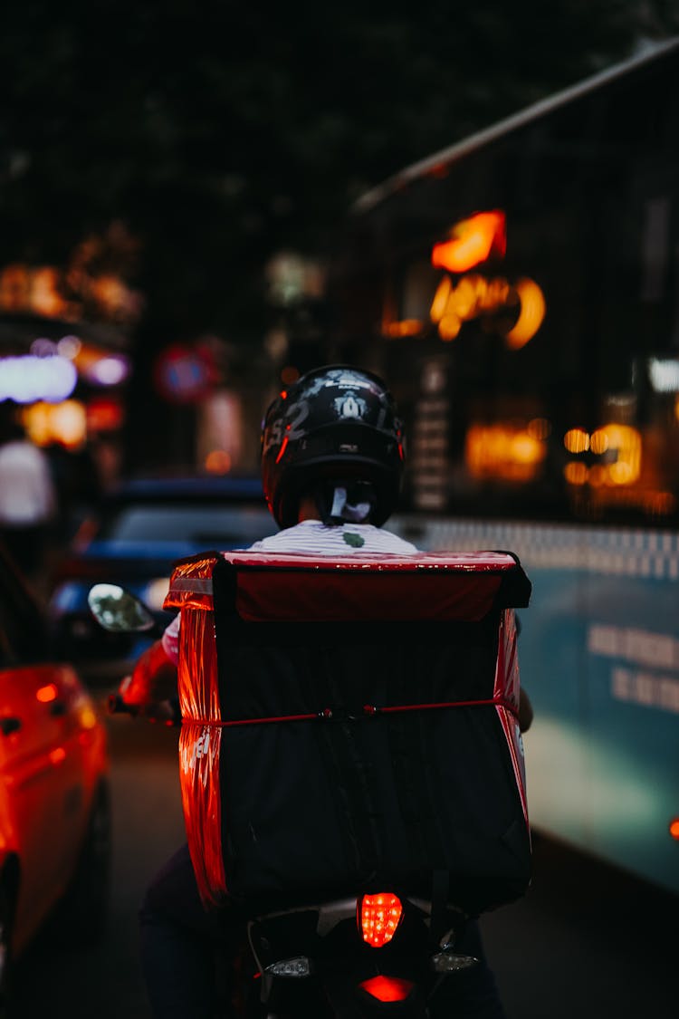 Silhouette Of A Person On A Motorbike Riding On The Street