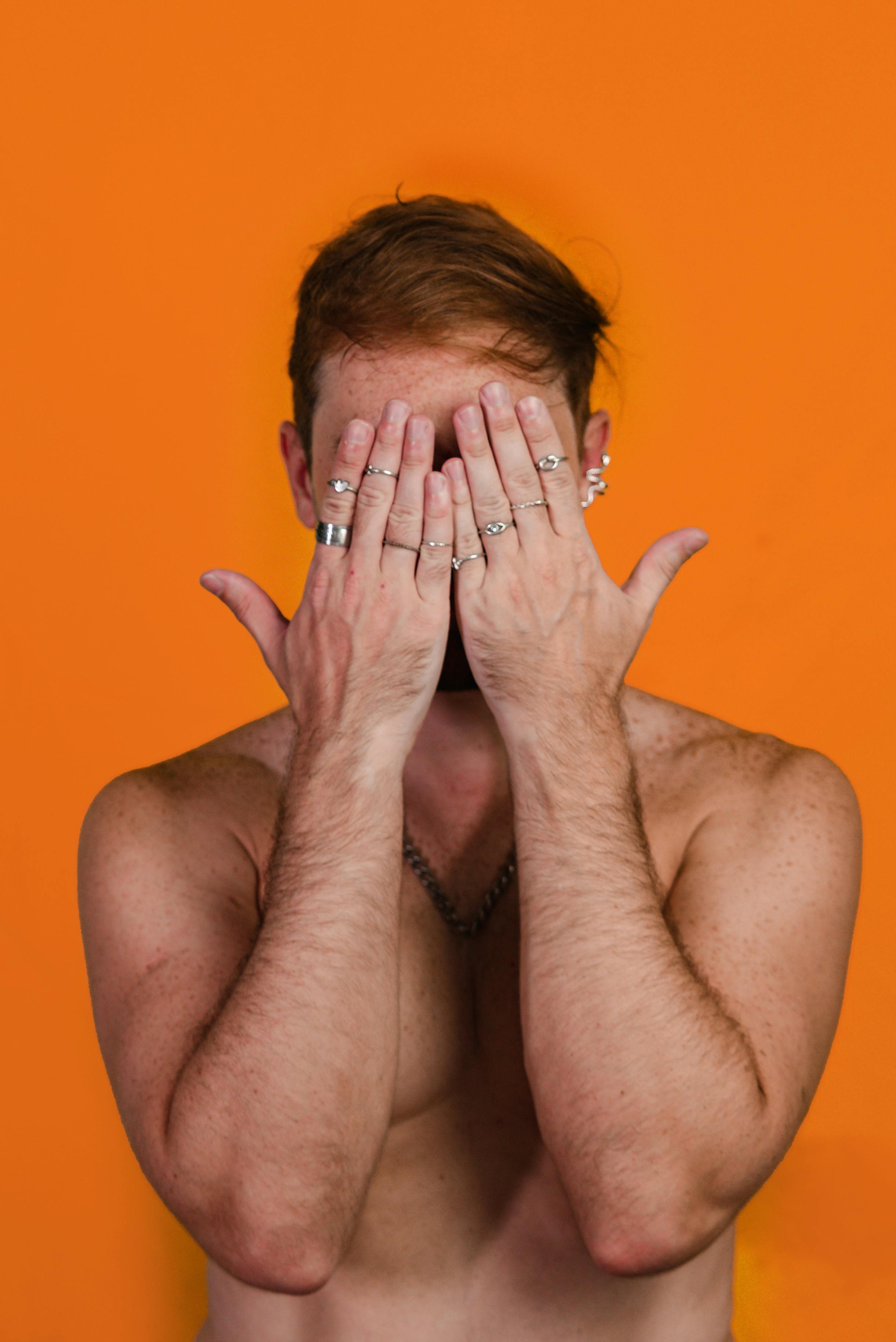 Portrait of a FineLooking Man Hiding His Face with Hands · Free Stock