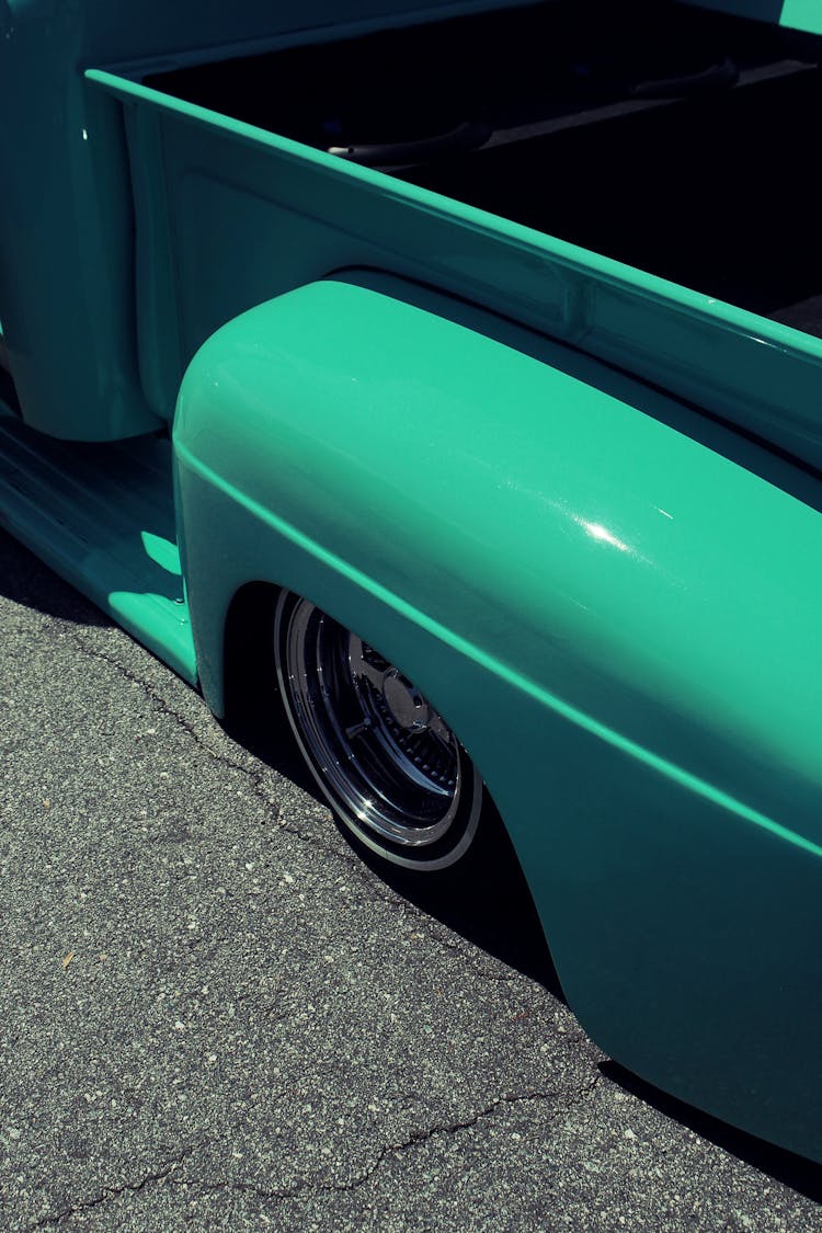 Close-up Of The Wheel And Fender Of A Turquoise Custom Ford Truck 