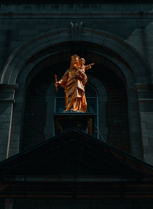 Golden Statue of Virgin Mary and Baby Jesus a Church in Montreal, Canada