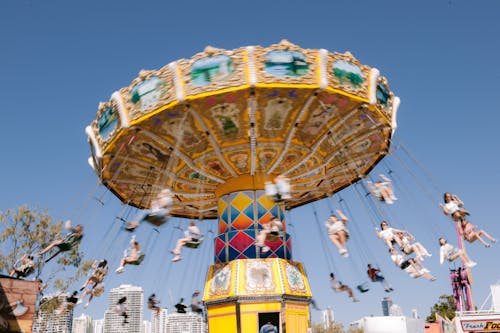 Decorative Carousel with People in Motion Blur