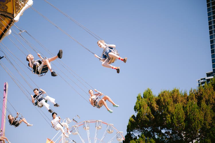 Children Enjoying A Carousel Ride