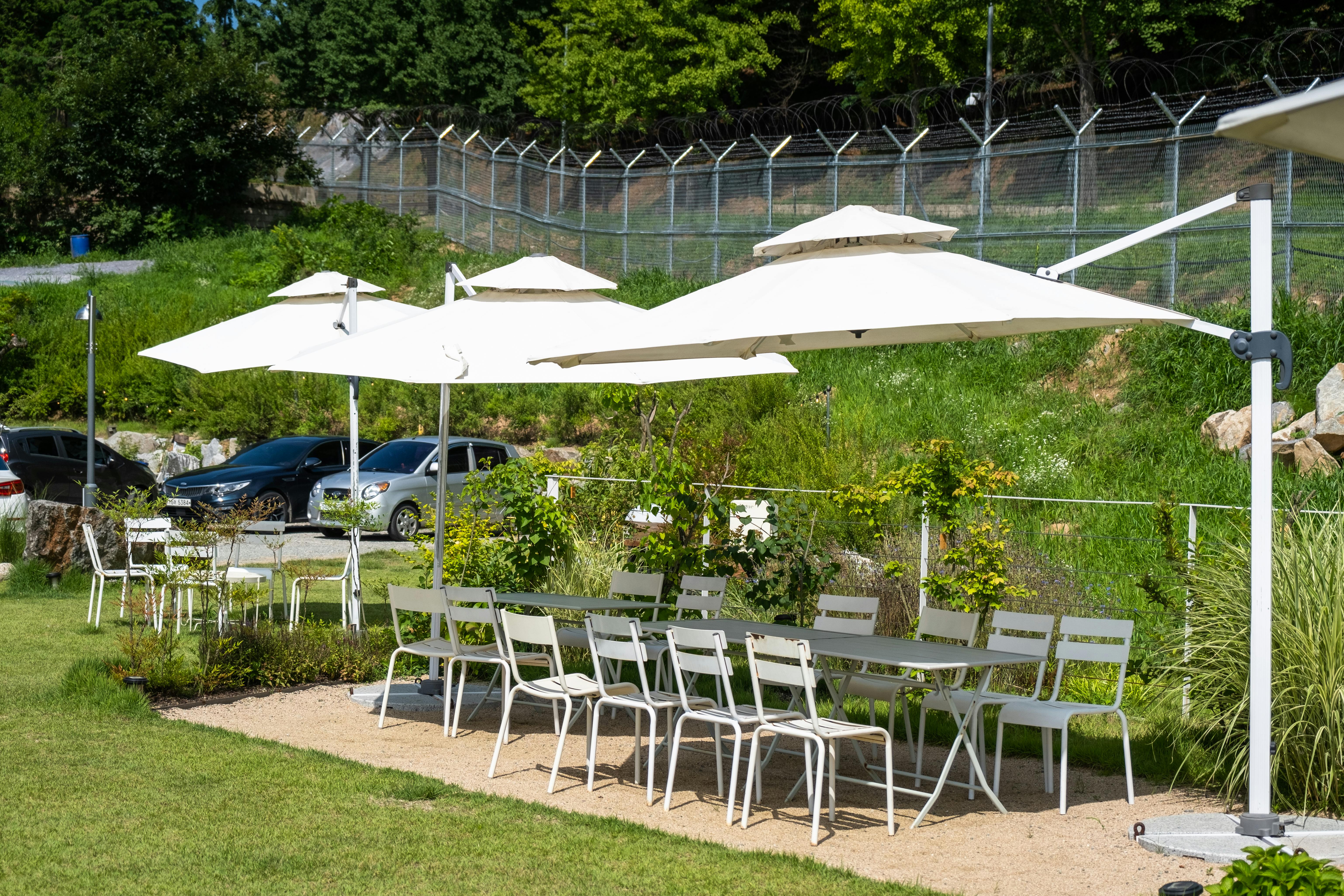 Outdoor garden dining area with umbrellas and seating