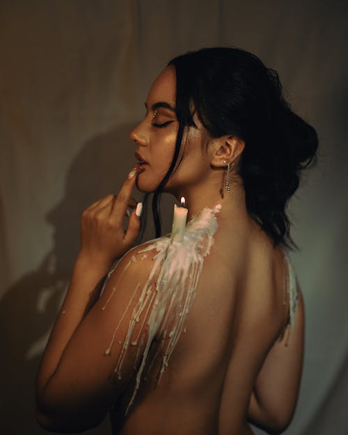 Naked Model with Candle on Shoulder