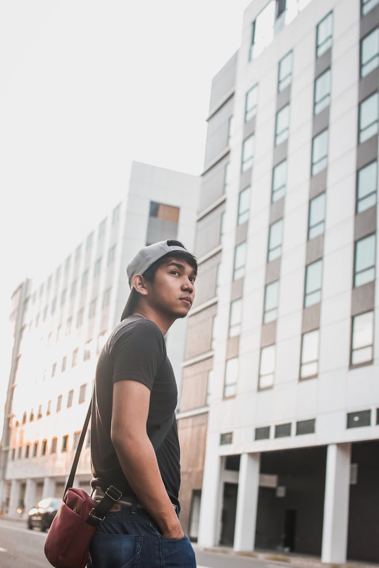 Young Man Walking On The Street 