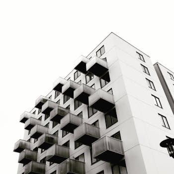Low-angle view of a modern building with unique geometric balconies in Stigberget, Sweden.
