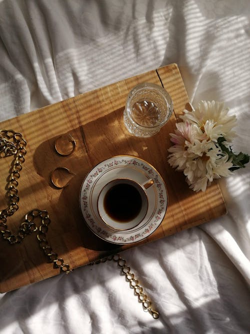 Free Cup of Coffee and a Glass of Water on the Sheet  Stock Photo