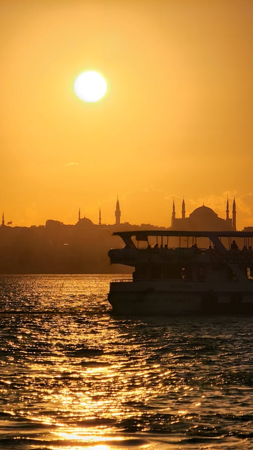 Ferry Sailing on Istanbul Coast at Sunset