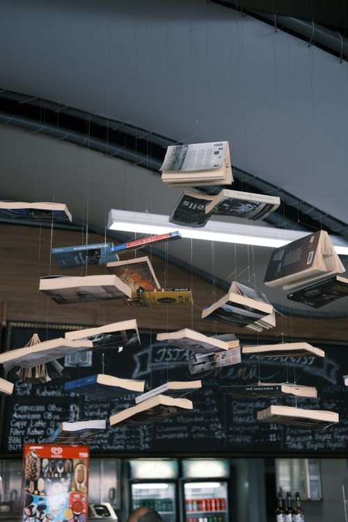 Free Floating books as creative ceiling décor in a cozy Istanbul café. Stock Photo