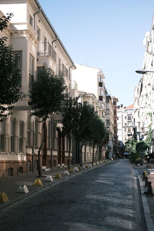 Free A picturesque cobblestone street in Istanbul featuring traditional architecture under the summer sun. Stock Photo