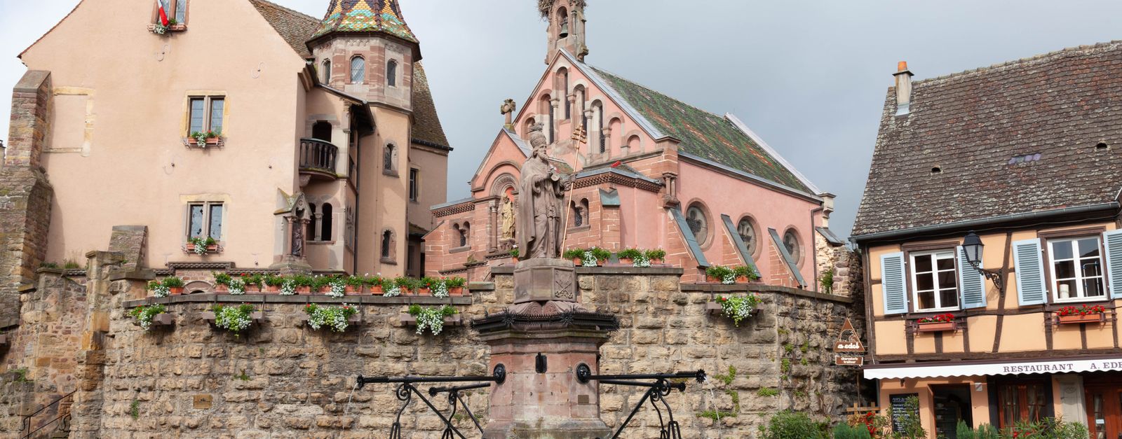 Discover the picturesque Saint Leon Square in Eguisheim, France, showcasing historic architecture and cultural heritage.
