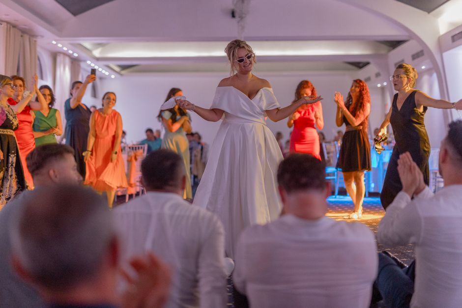 wedding reception hall with guests dancing evening celebration