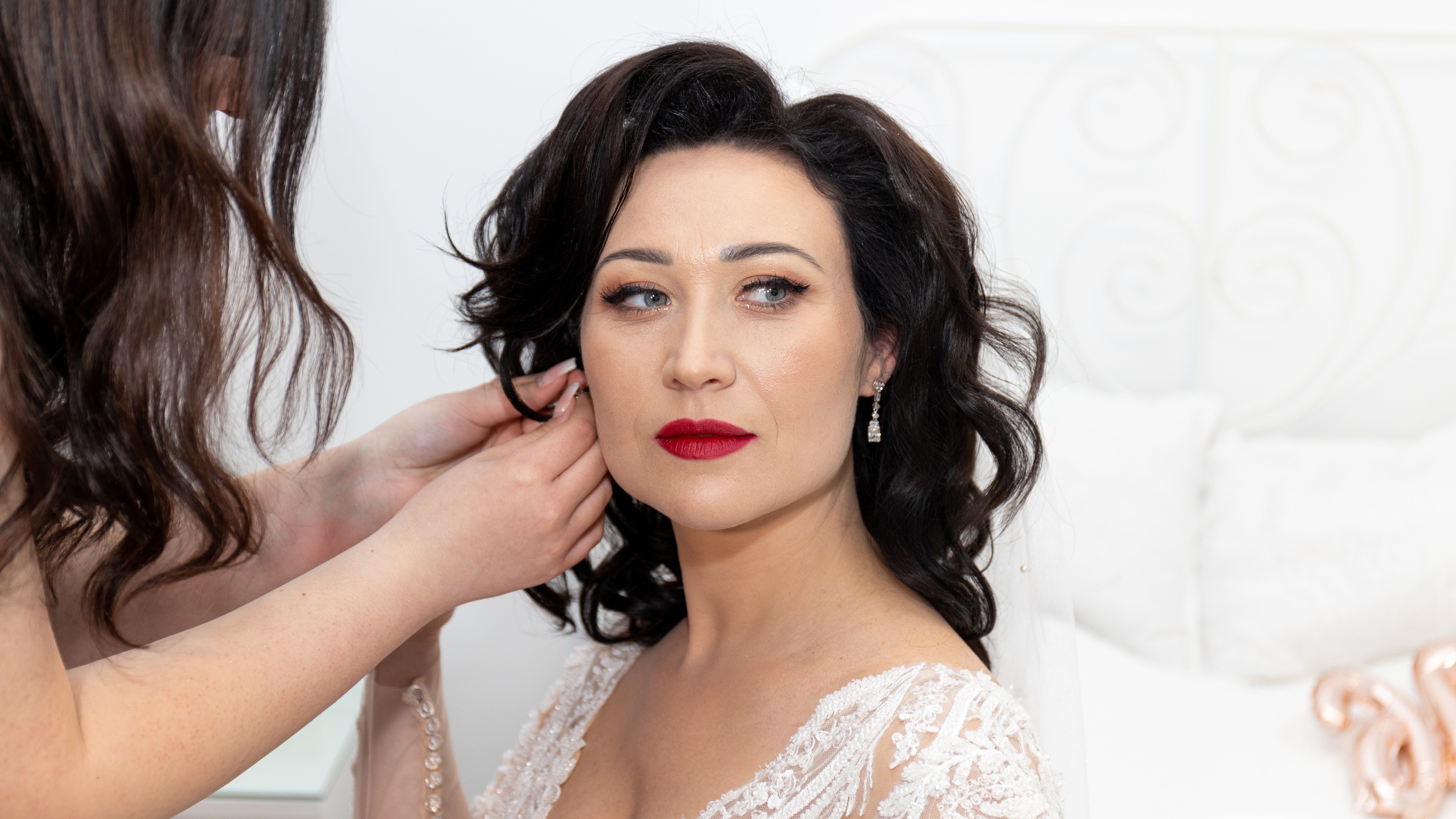 Bride preparing elegantly for her wedding ceremony