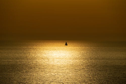 Sailboat on Sea at Sunset