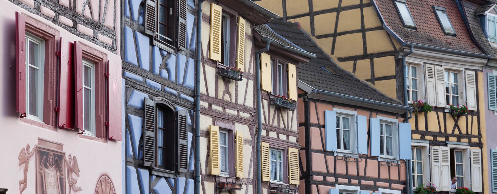 Colorful half-timbered buildings in Colmar, France capture historic European architecture.
