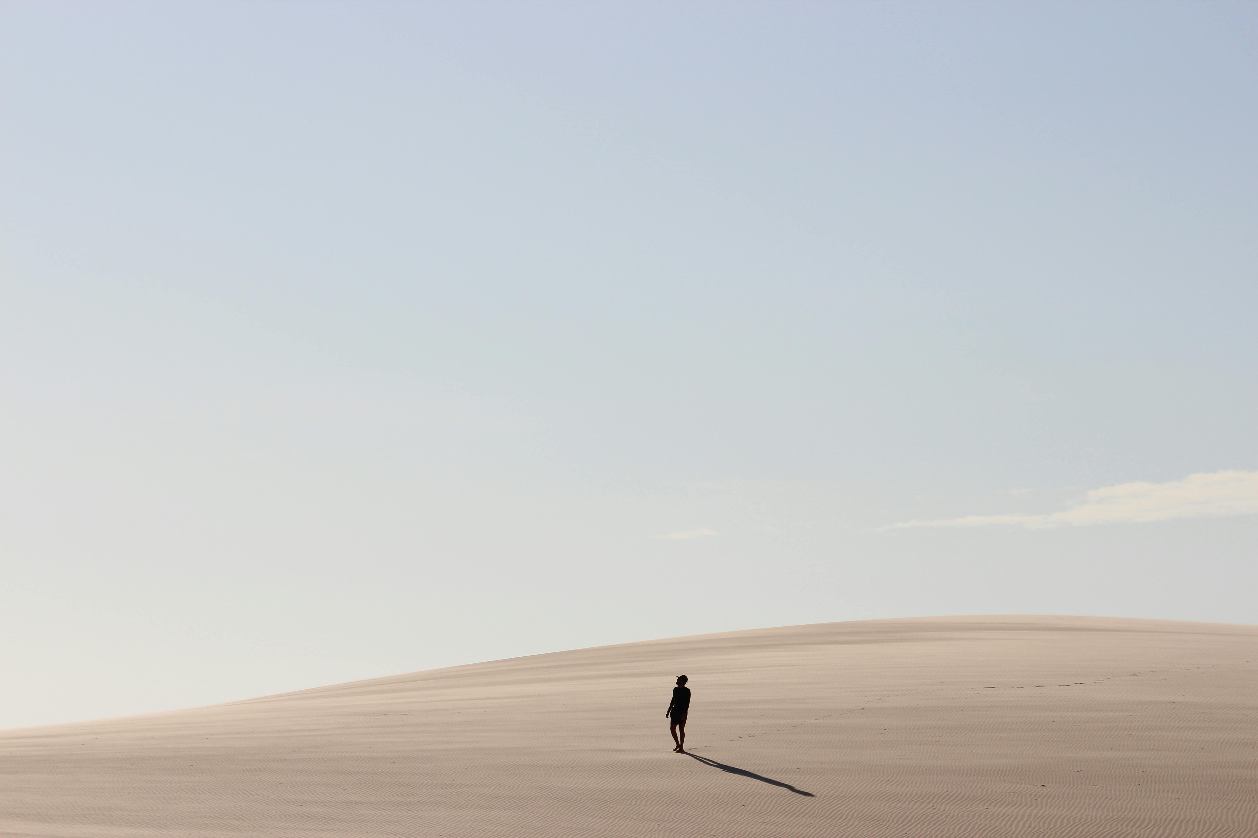 Person Walking on Desert · Free Stock Photo