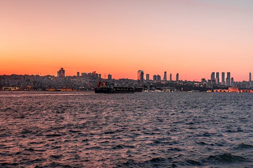 Sea and City Skyline at Sunset 