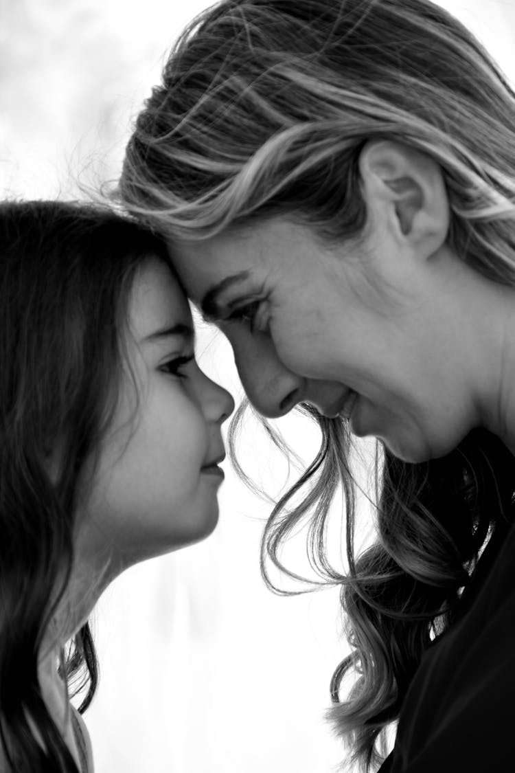 Mother And Daughter Faces Together