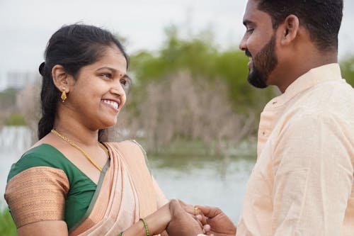 A Couple Looking at Each Other and Smiling 