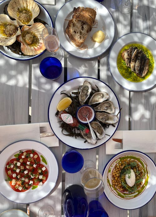 Free Table with Seafood and Vegetarian Salads Stock Photo