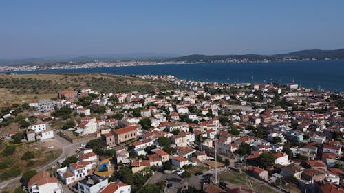 Aerial View of Houses in a City around a Bay 