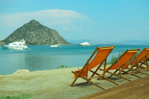 Sunloungers on the Beach with the View of a Volcano 
