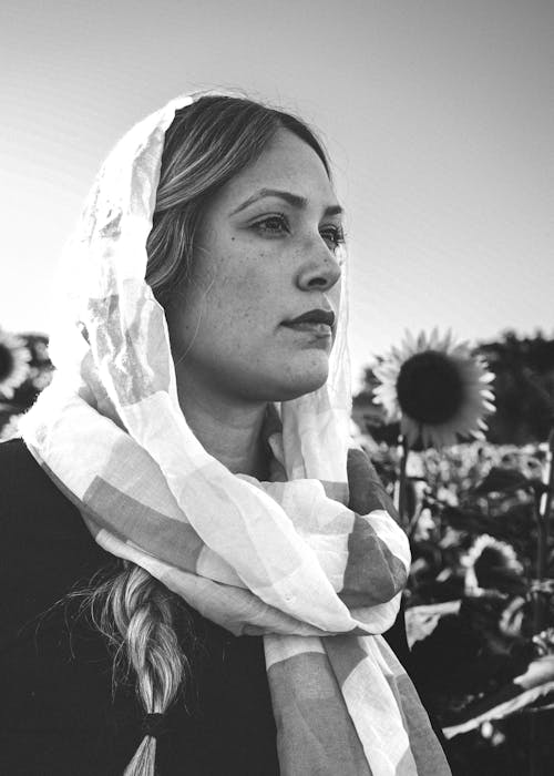 Woman in Handkerchief on Field of Sunflowers