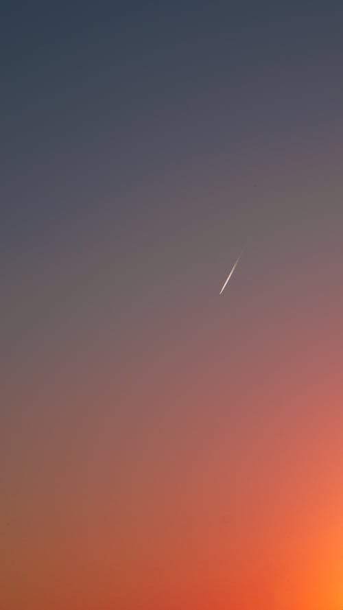 Contrail on Clear Sky at Sunset