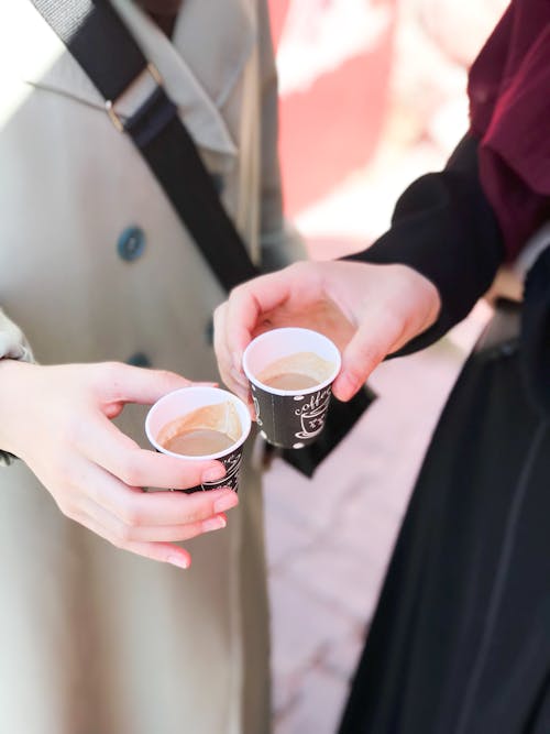 People Drinking Coffee on a Street