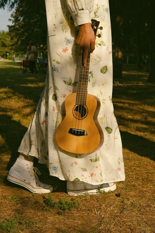 Woman in a Park with a Guitar