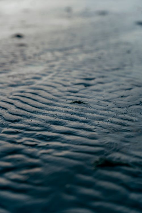 Free Close-up view of rippled sand and water texture on Bilgah beach, Azerbaycan. Stock Photo