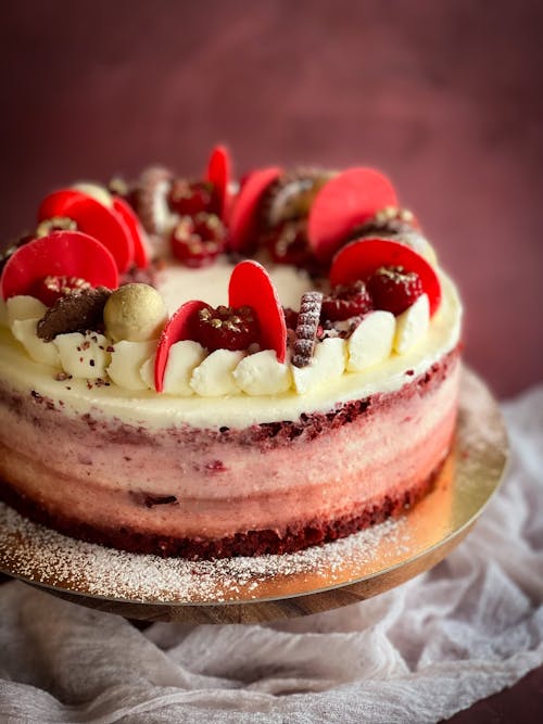 Red Velvet Cake With Caramelised Peanuts, Raspberries And Cream Cheese Frosting