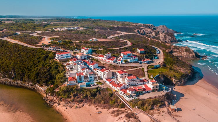 Aerial Panorama Of A Picturesque Hill Village At Ocean Shore, Odeceixe, Portugal