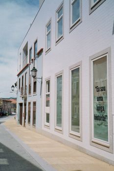 Contemporary building facade in Barcelos, Braga, with street view and windows.