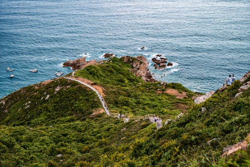 People on the Rocky Seashore