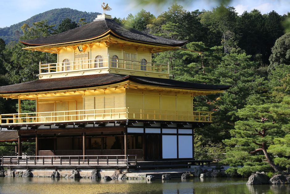 The stunning Golden Pavilion (Kinkaku-ji) reflecting in the pond in Kyoto, Japan.